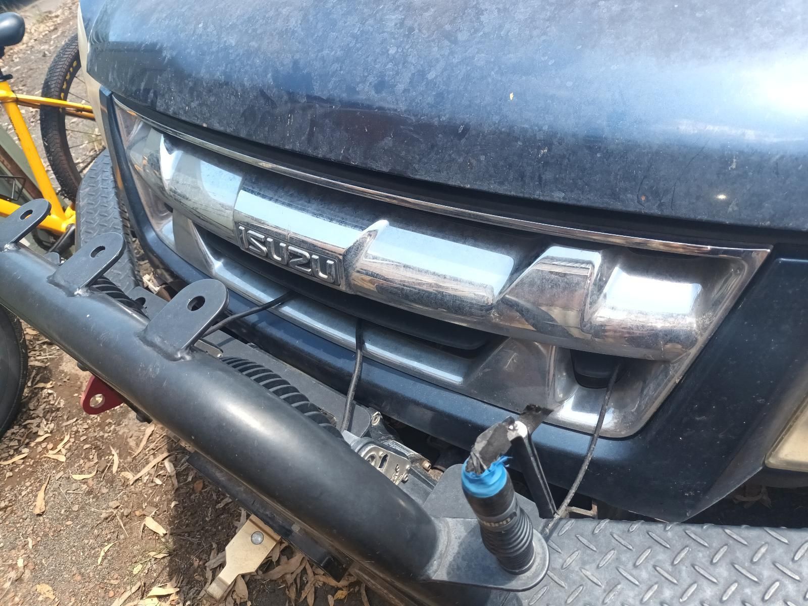 A Close Up of a Car's Grille with the Word Isuzu on It — South West 4WD Wreckers in Harristown, QLD