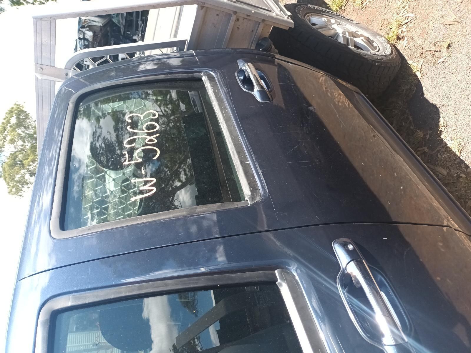 A Blue Car with a Numbers Written on the Side — South West 4WD Wreckers in Harristown, QLD