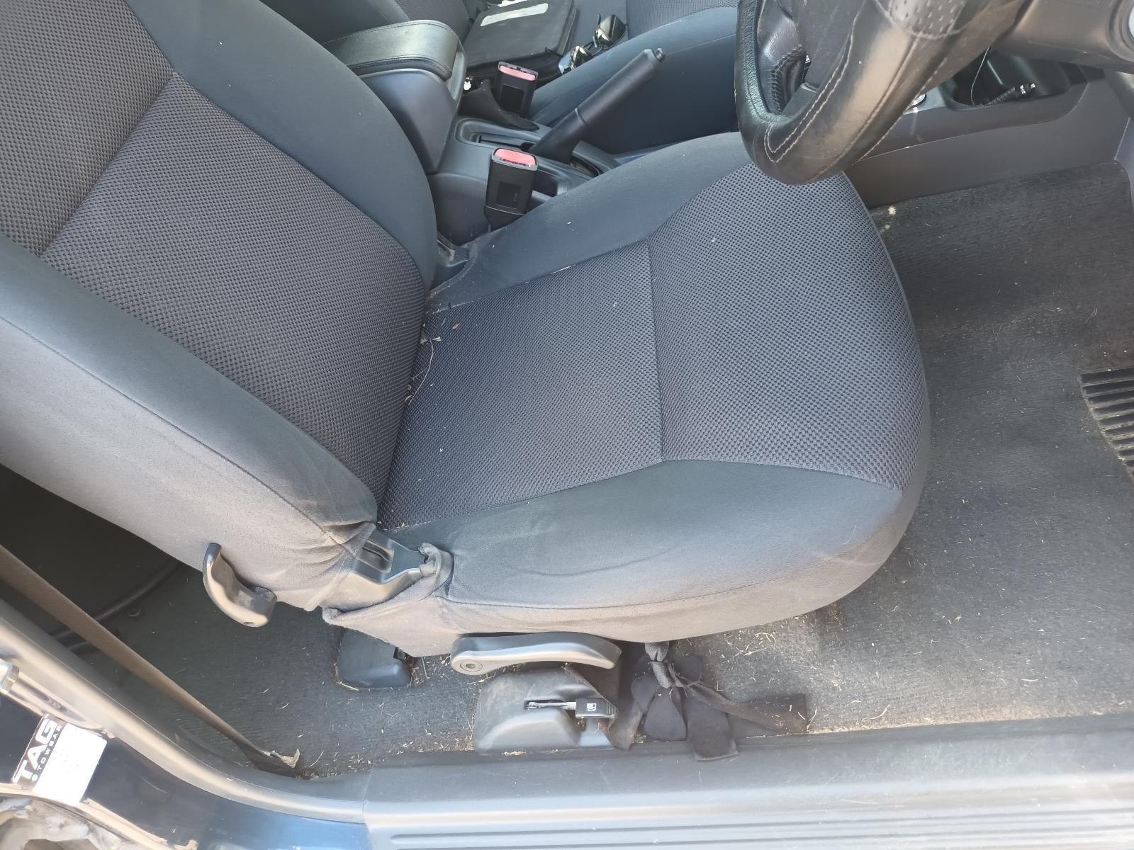 A Black Car Seat with a Steering Wheel in the Background — South West 4WD Wreckers in Harristown, QLD