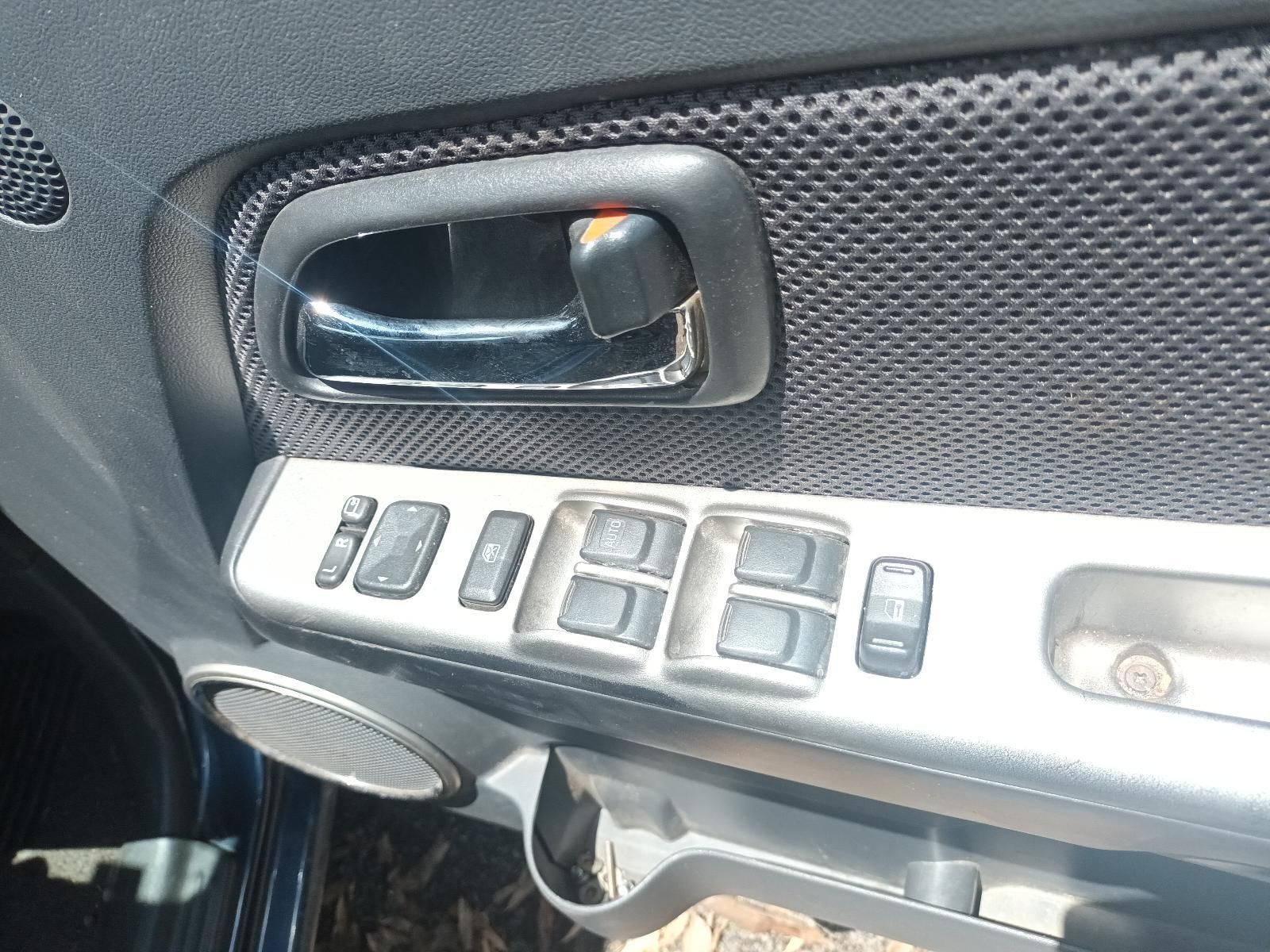 A Close Up of a Car Door with Buttons on It — South West 4WD Wreckers in Harristown, QLD