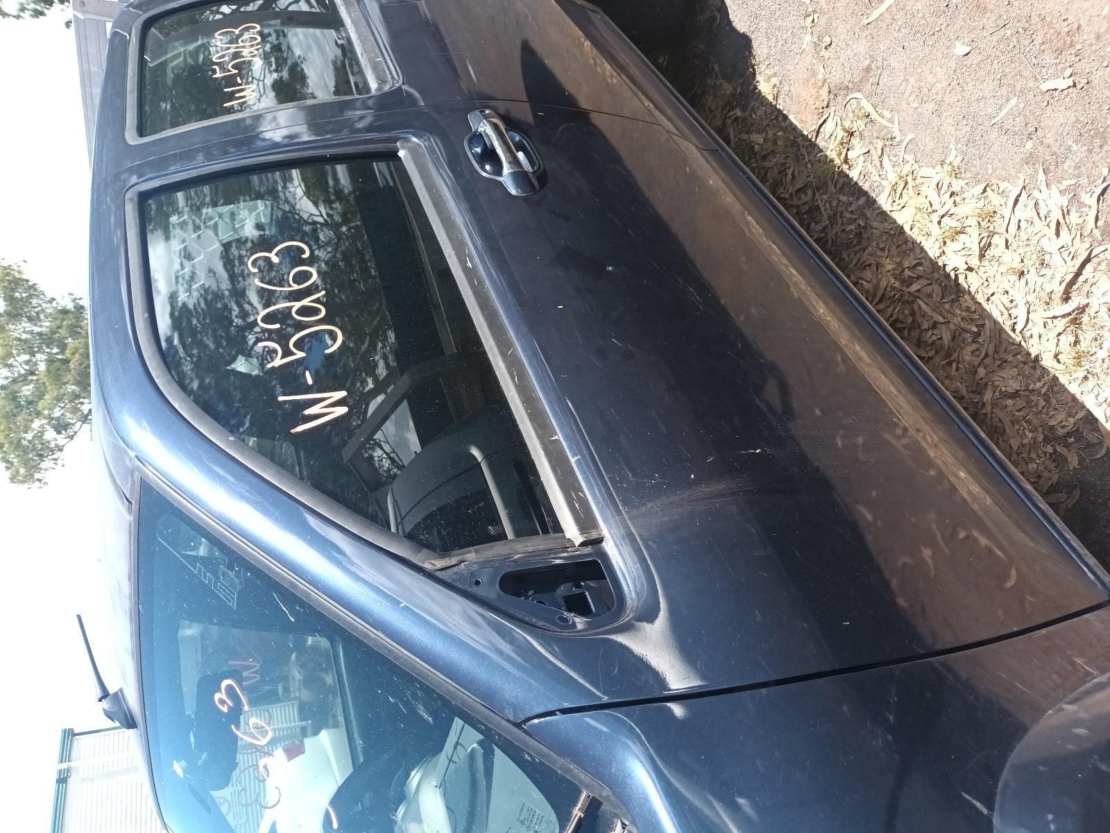 A Black Car is Parked on the Side of the Road — South West 4WD Wreckers in Harristown, QLD