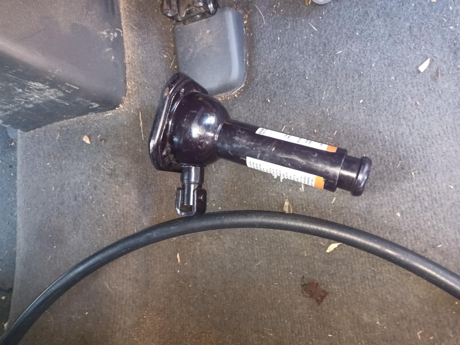 A Black Object is Sitting on the Floor Next to a Hose — South West 4WD Wreckers in Harristown, QLD