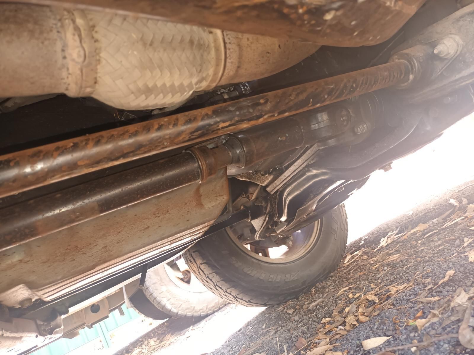 A Close Up of the Underside of a Car with a Tire — South West 4WD Wreckers in Harristown, QLD