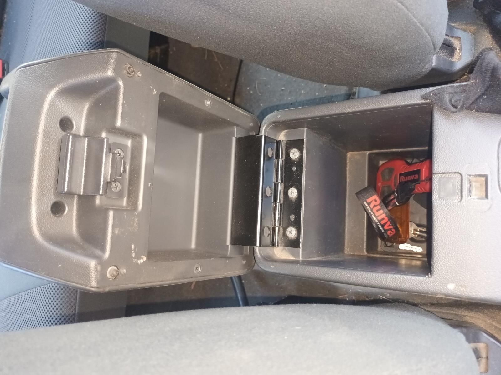 A Car Console with a Coca Cola Bottle in It — South West 4WD Wreckers in Harristown, QLD