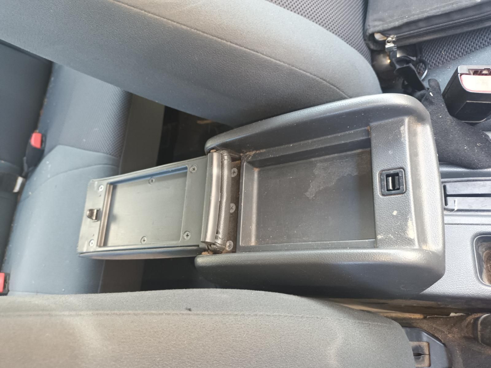 A Car Arm Rest with the Lid Open and a USB Port — South West 4WD Wreckers in Harristown, QLD