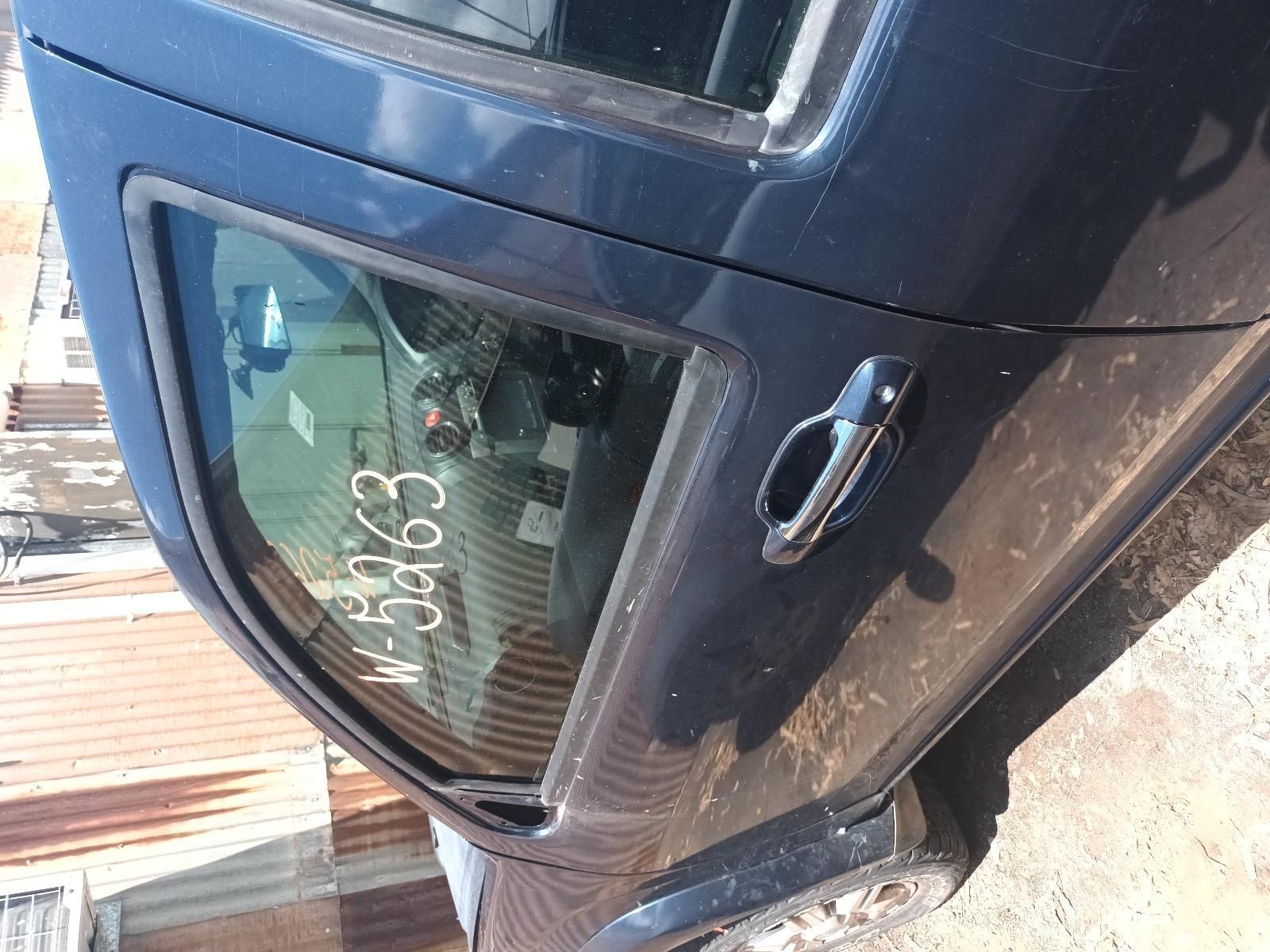 A Blue Car with a License Plate on the Side — South West 4WD Wreckers in Harristown, QLD