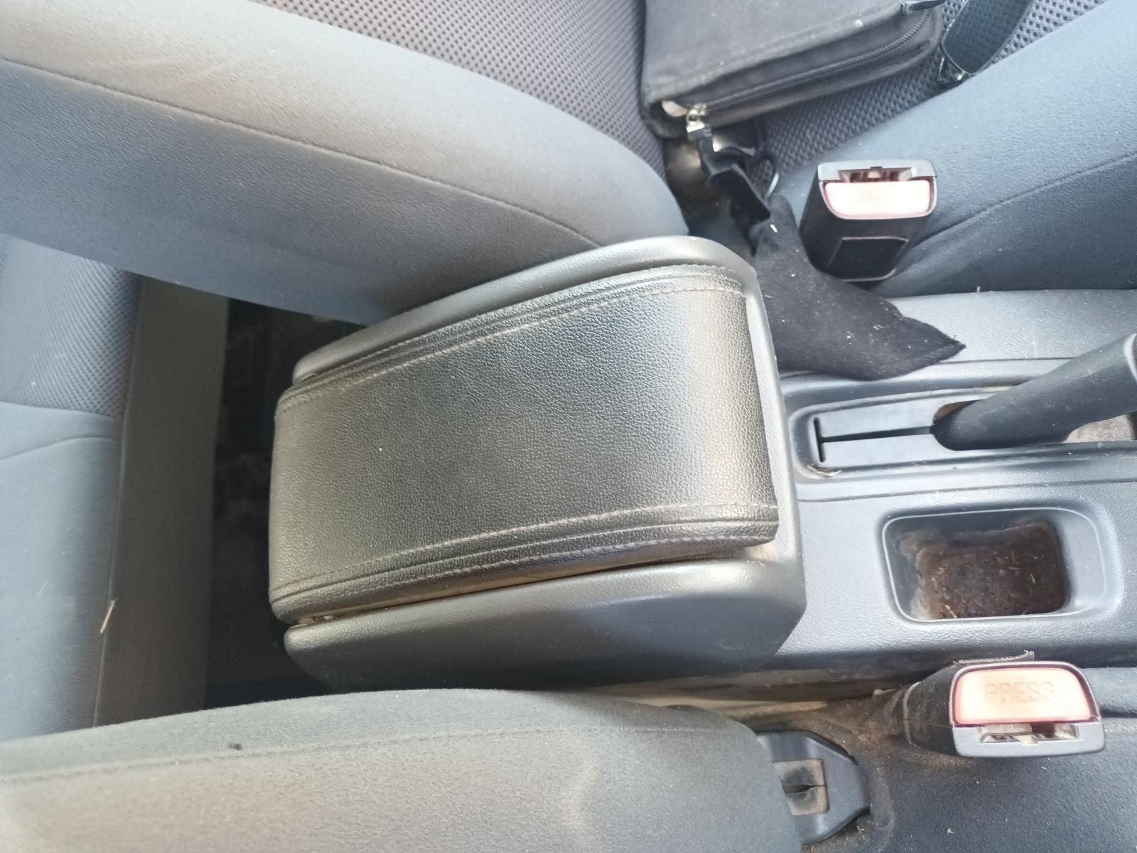 A Black Arm Rest in a Car Next to a Seat Belt — South West 4WD Wreckers in Harristown, QLD
