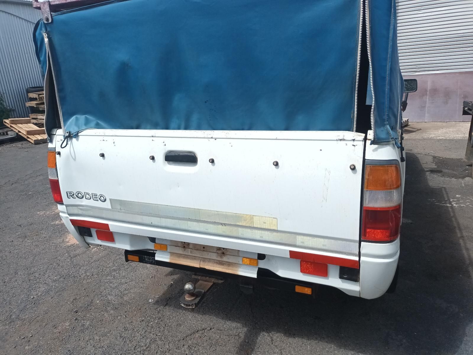 A White Truck with a Blue Tarp on Top of It — South West 4WD Wreckers in Harristown, QLD