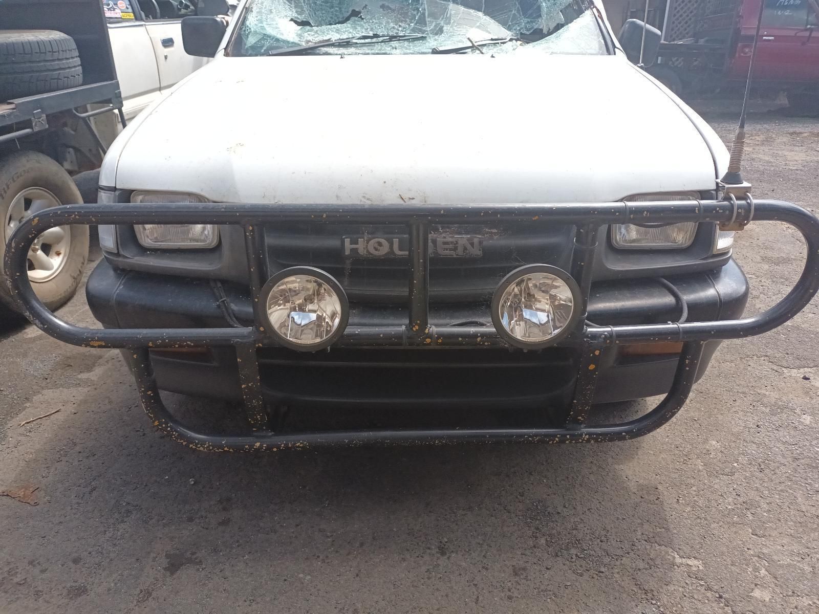 A White Truck with a Black Bumper is Parked in a Parking Lot — South West 4WD Wreckers in Harristown, QLD