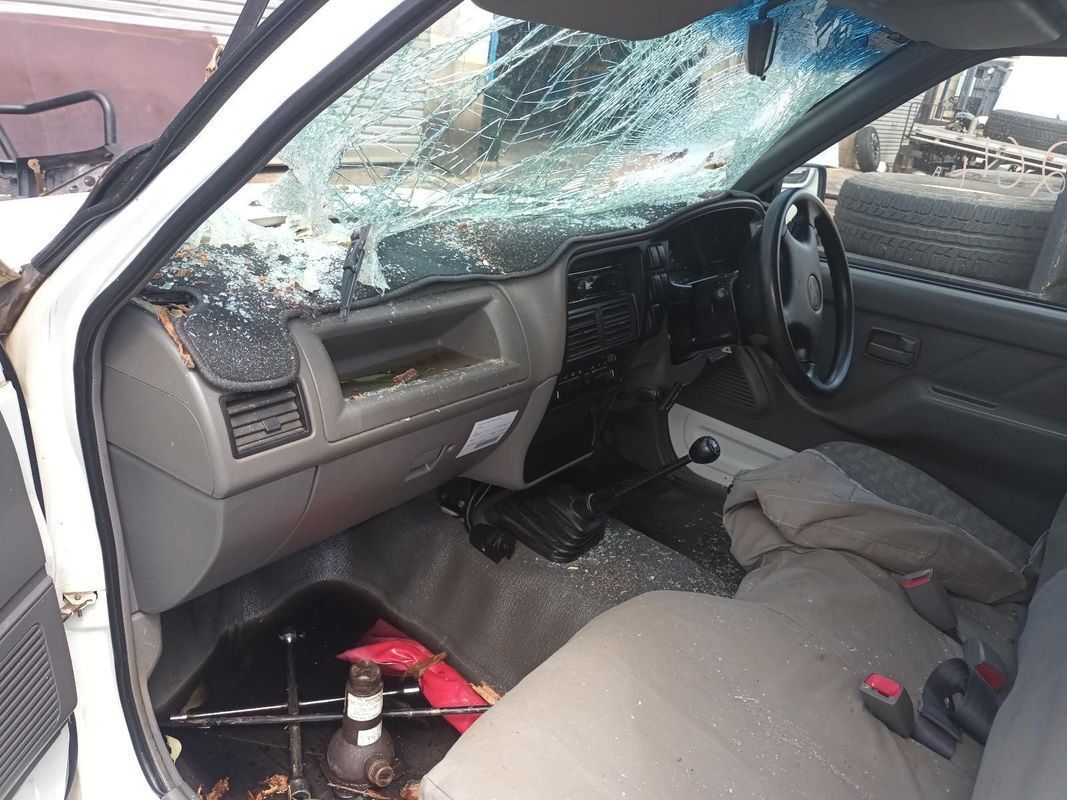 The Inside of a White Car with a Broken Windshield — South West 4WD Wreckers in Harristown, QLD