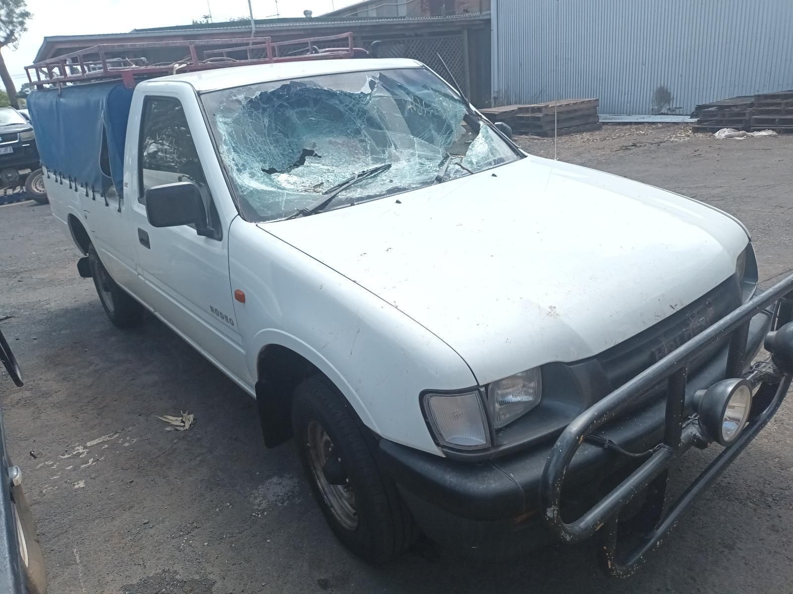 A White Truck with a Broken Windshield is Parked in a Parking Lot — South West 4WD Wreckers in Harristown, QLD