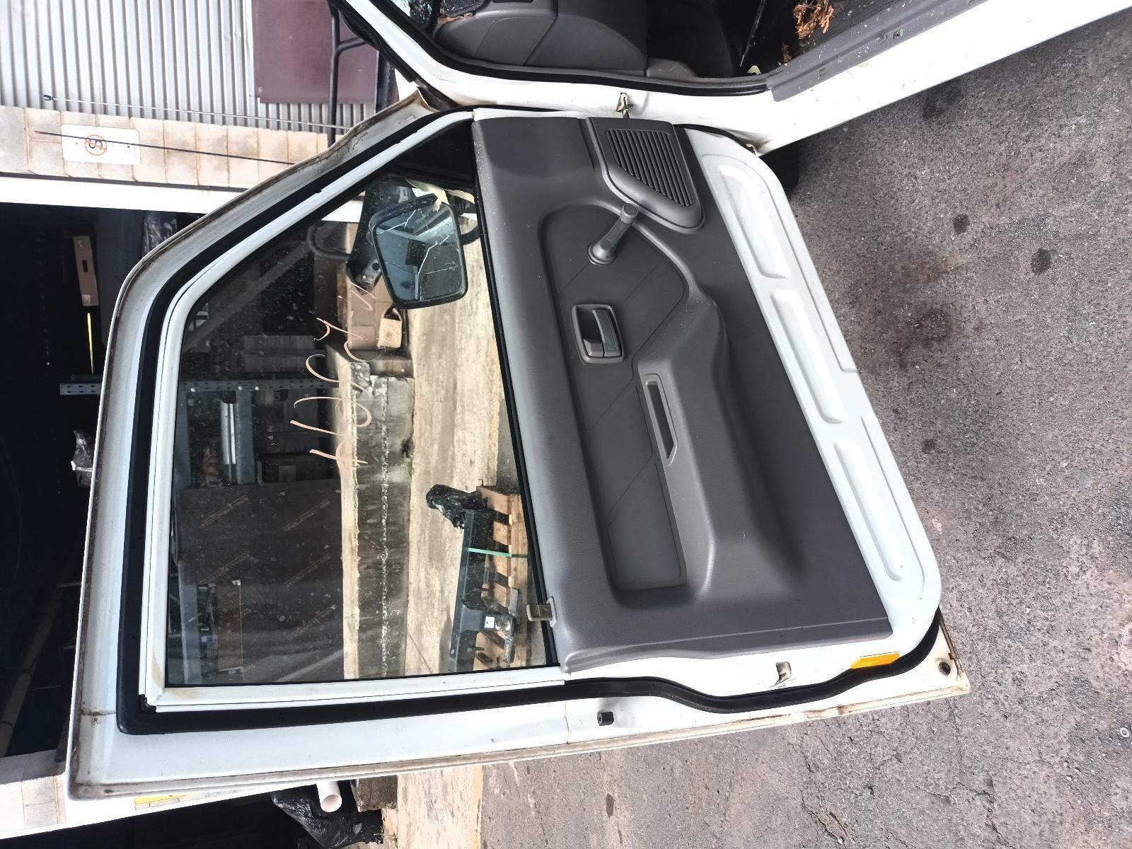 A White Car with the Door Open is Parked in a Garage — South West 4WD Wreckers in Harristown, QLD