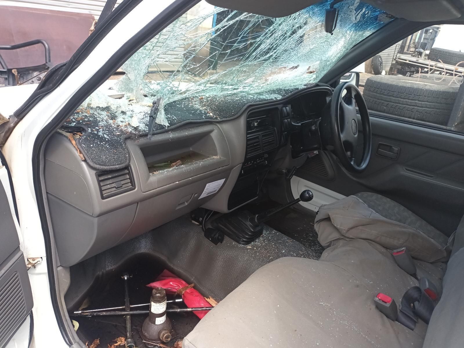 The Inside of a White Car with a Broken Windshield — South West 4WD Wreckers in Harristown, QLD