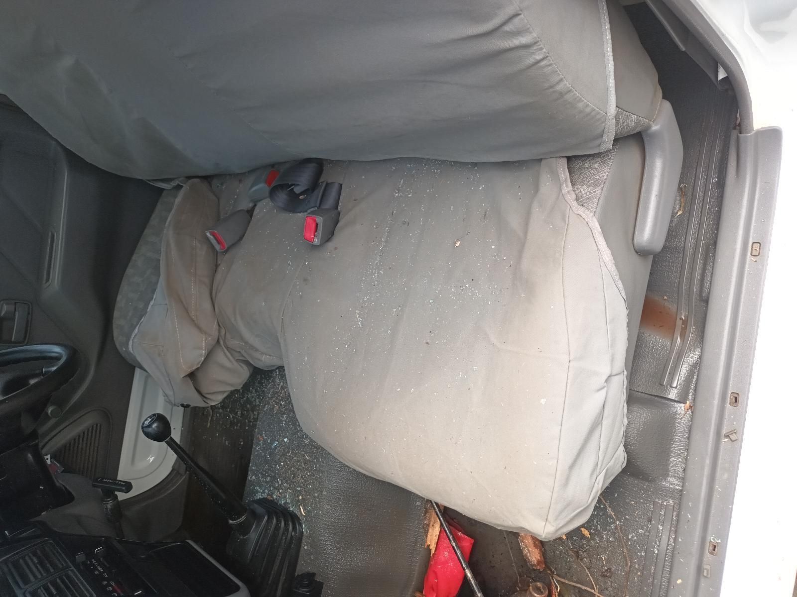 A White Car with a Gray Seat Cover on It — South West 4WD Wreckers in Harristown, QLD