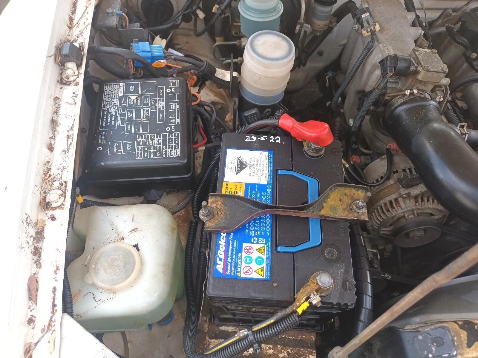 A Black Acdelco Battery is Sitting Under the Hood of a Car — South West 4WD Wreckers in Harristown, QLD