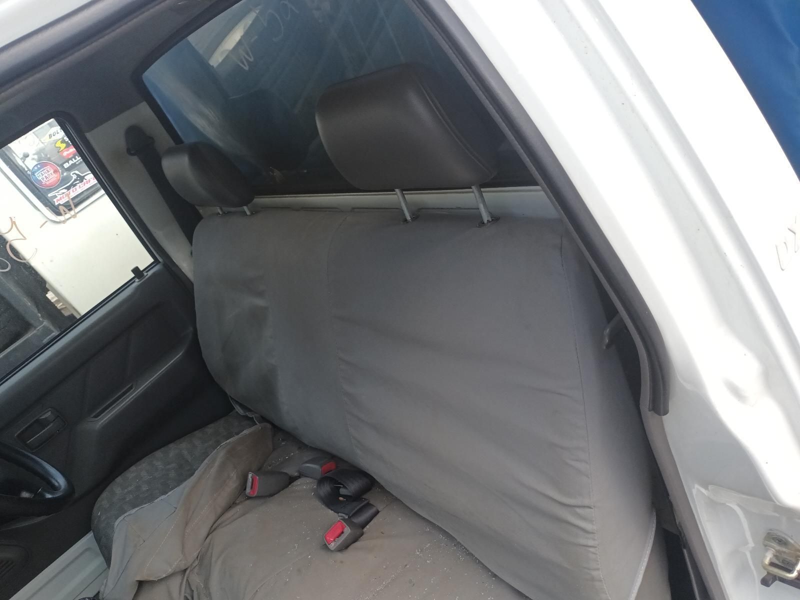 The Back Seat of a White Truck with a Grey Seat Cover — South West 4WD Wreckers in Harristown, QLD
