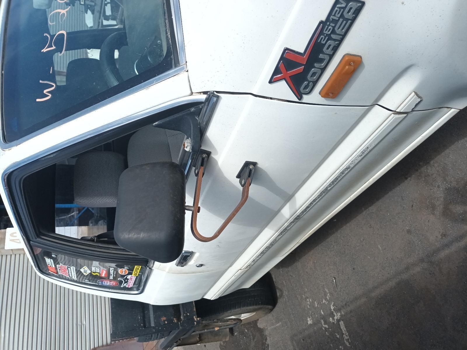 A White Truck with Xl Courier Written on the Side — South West 4WD Wreckers In Brisbane, QLD