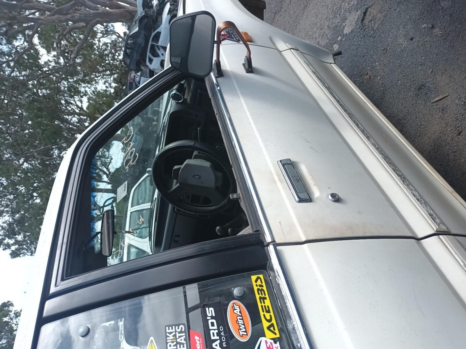 A White Truck with a Sticker on the Door That Says Acerbis — South West 4WD Wreckers In Brisbane, QLD