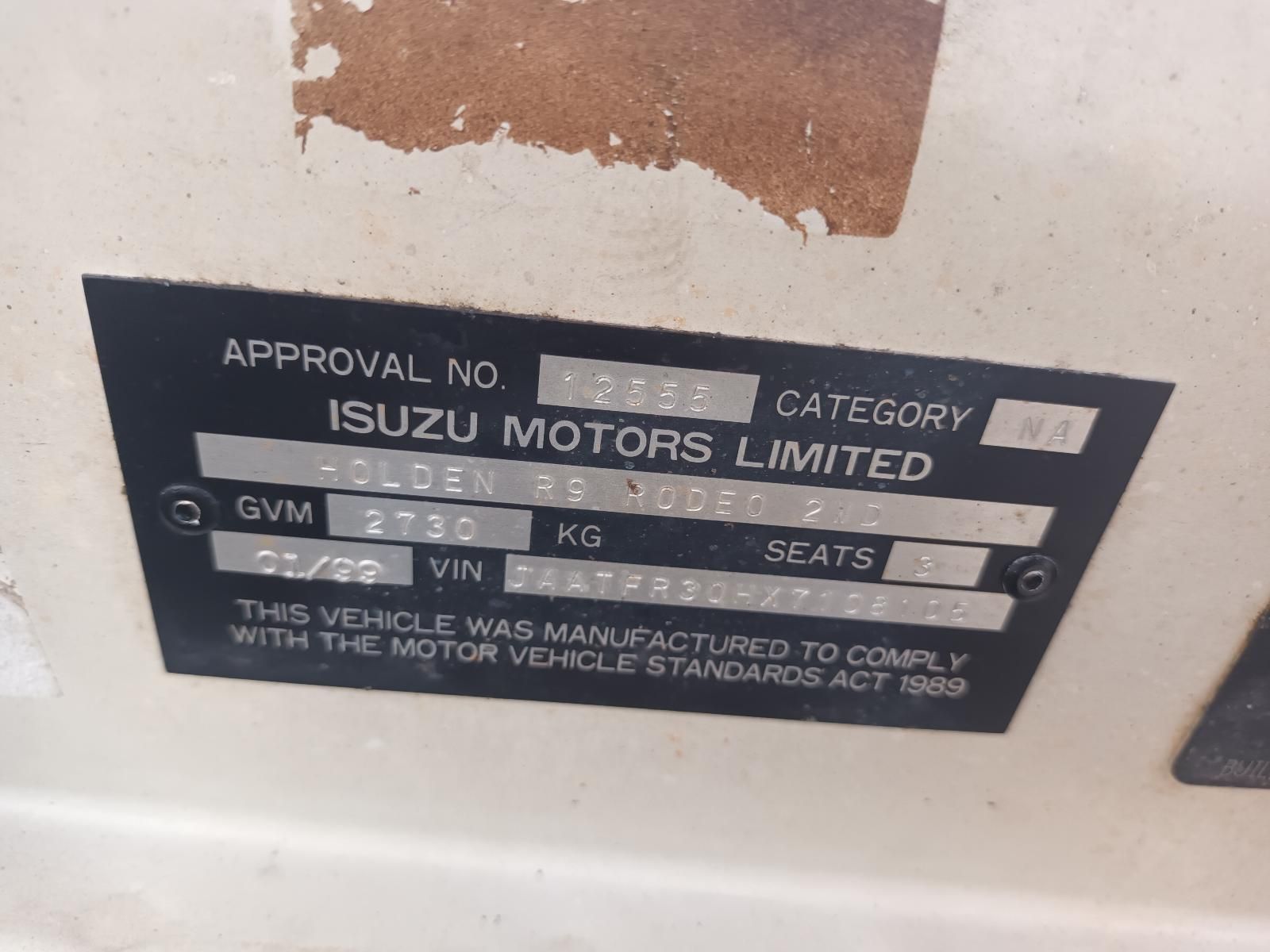 A Close Up of a License Plate That Says Approval No Isuzu Motors Limited — South West 4WD Wreckers In Brisbane, QLD