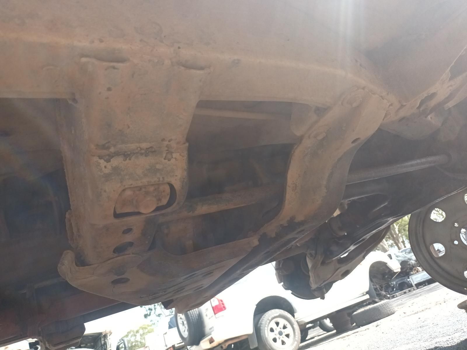 The uNderside of a Truck is Shown in a Parking Lot — South West 4WD Wreckers In Brisbane, QLD
