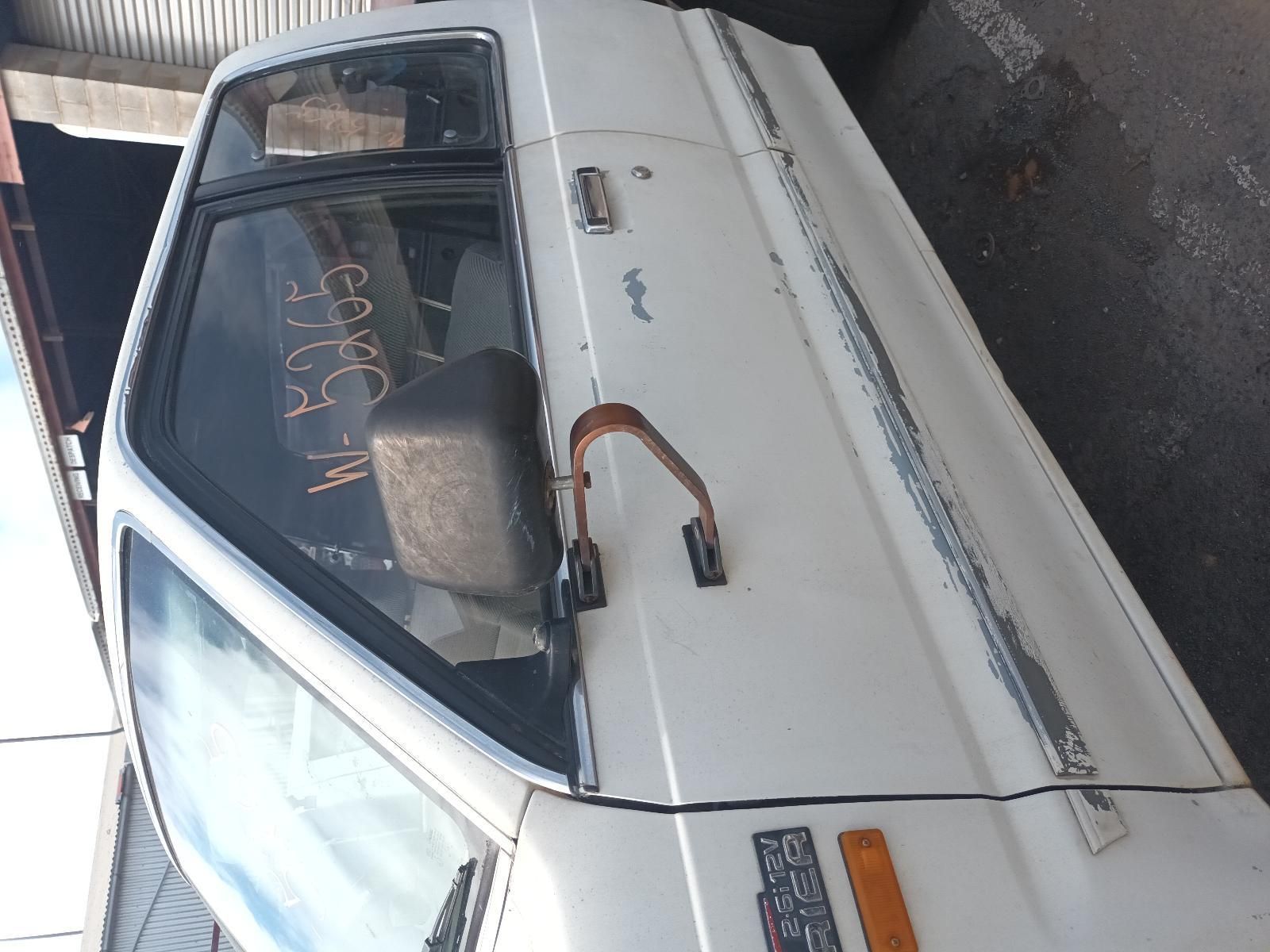 A White Truck is Parked on the Side of the Road — South West 4WD Wreckers In Brisbane, QLD
