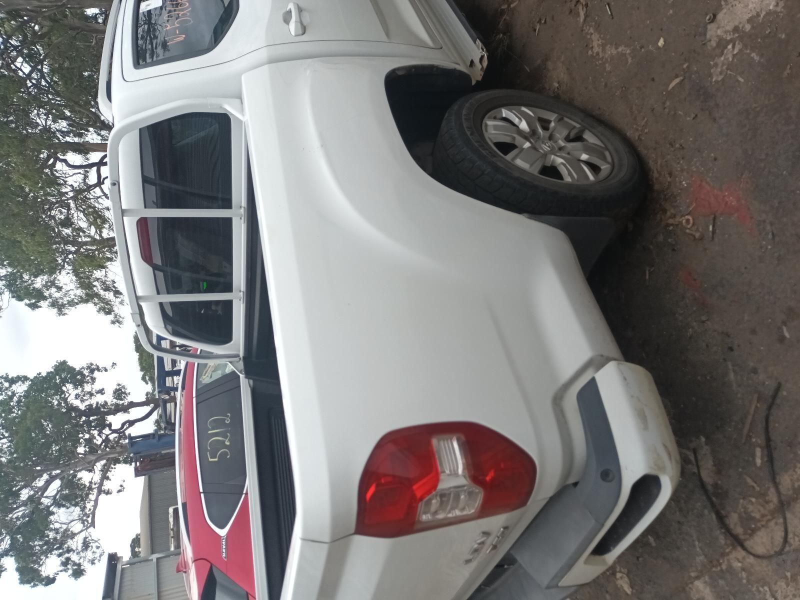 A White Truck is Parked on the Side of the Road — South West 4WD Wreckers In Brisbane, QLD