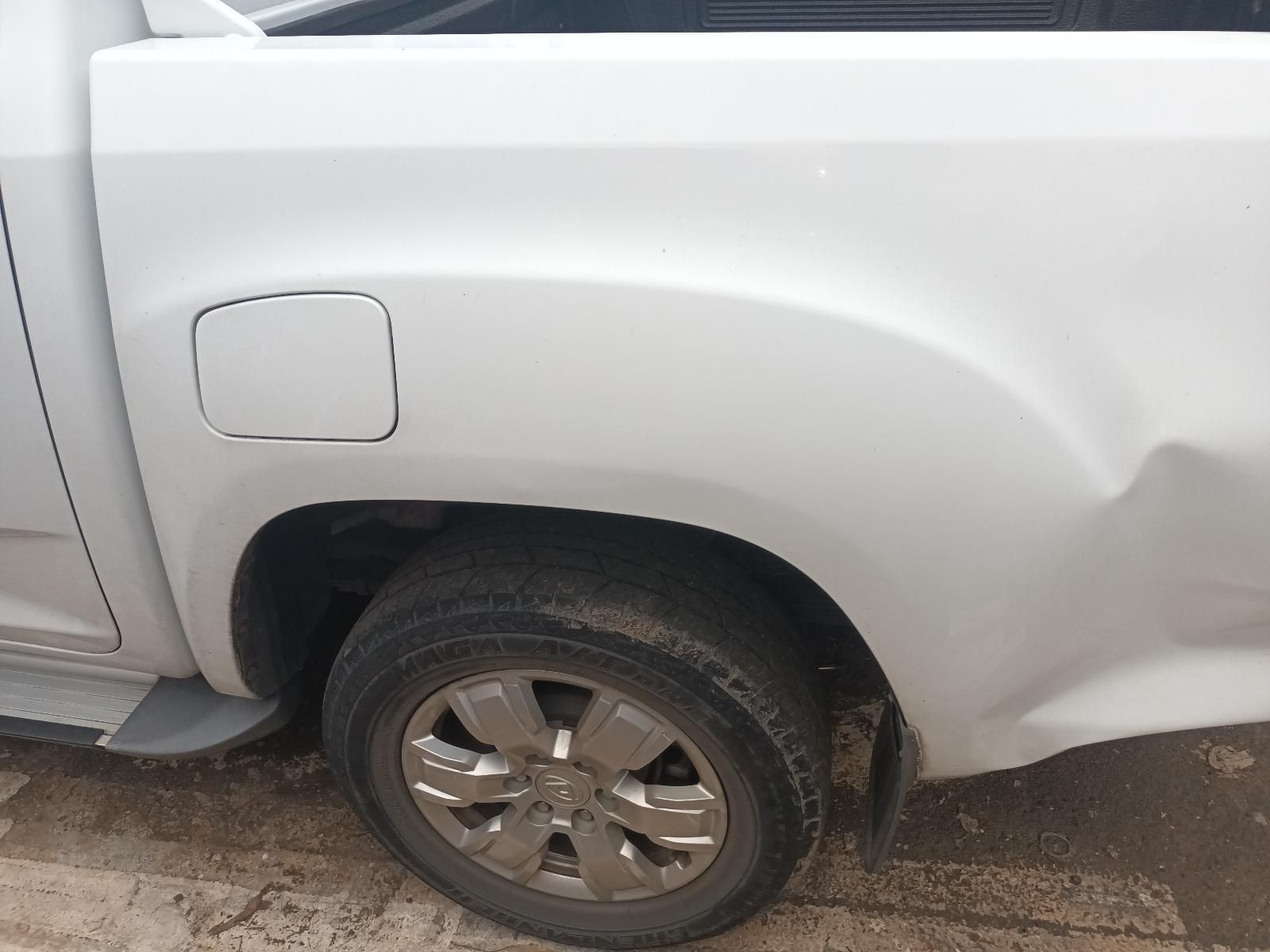 A White Truck is Parked on the Side of the Road — South West 4WD Wreckers In Brisbane, QLD