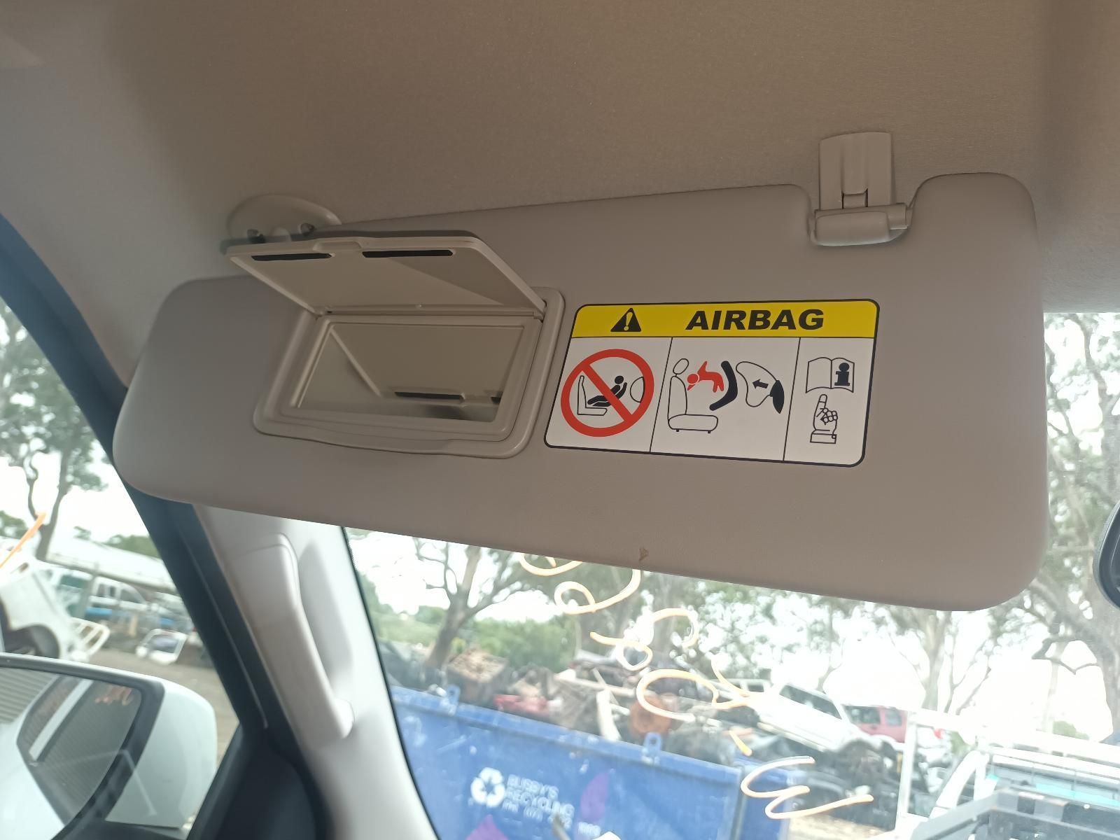 A Sun Visor with a Warning Sign on It That Says Airbag — South West 4WD Wreckers In Brisbane, QLD