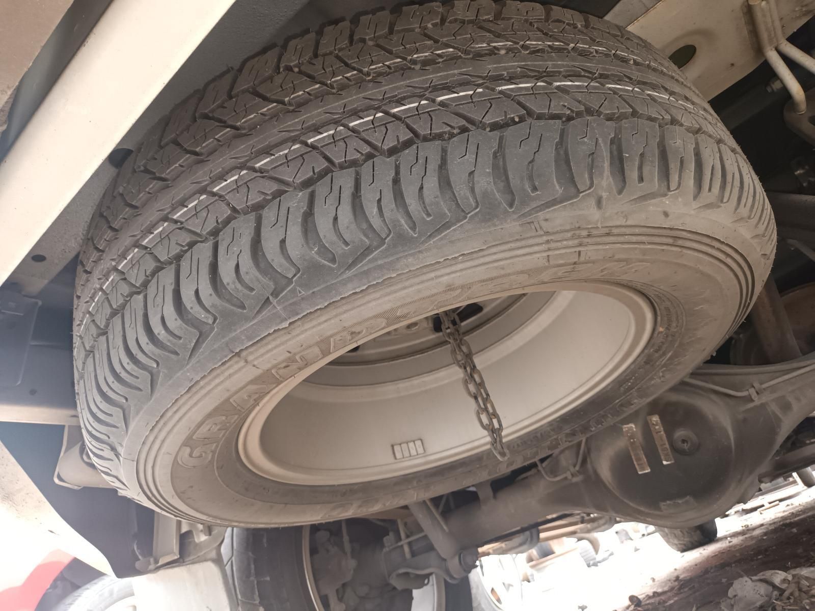A Close Up of a Tire on a Car with a Chain Attached to It — South West 4WD Wreckers In Brisbane, QLD