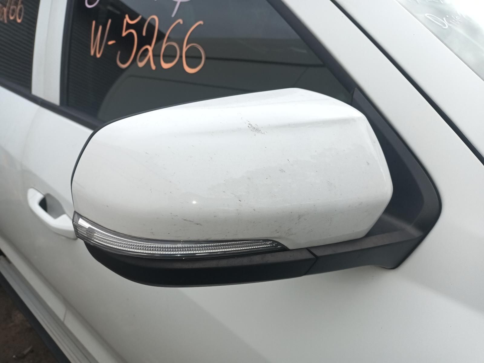 A White Car with W-5266 Written on the Side — South West 4WD Wreckers In Brisbane, QLD