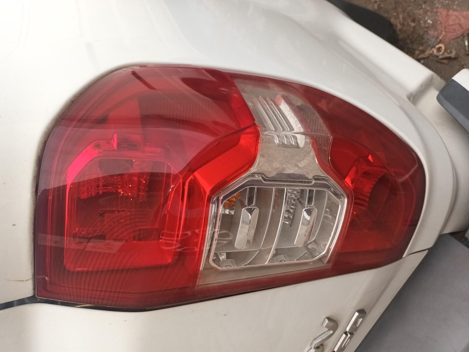 A White Car with a Red Tail Light on It — South West 4WD Wreckers In Brisbane, QLD