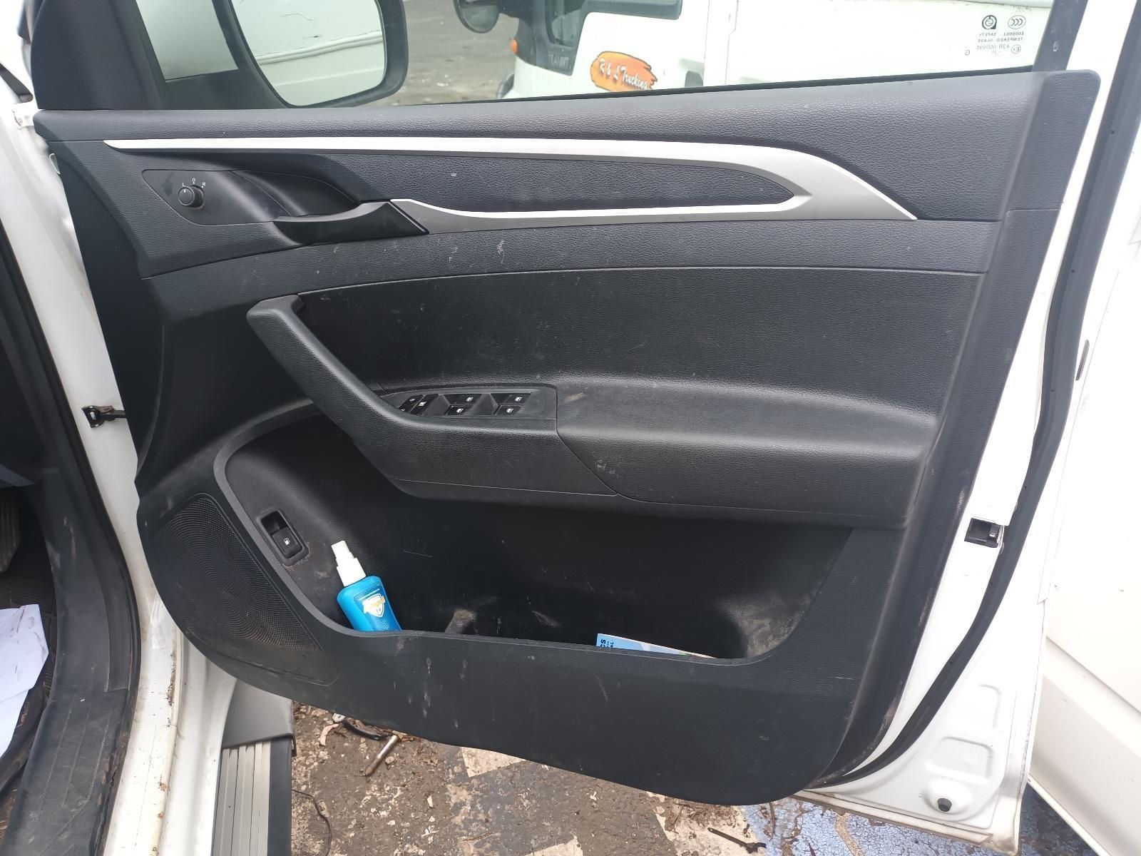 A White Car with the Door Open and a Bottle of Hand Sanitizer in the Pocket — South West 4WD Wreckers In Brisbane, QLD