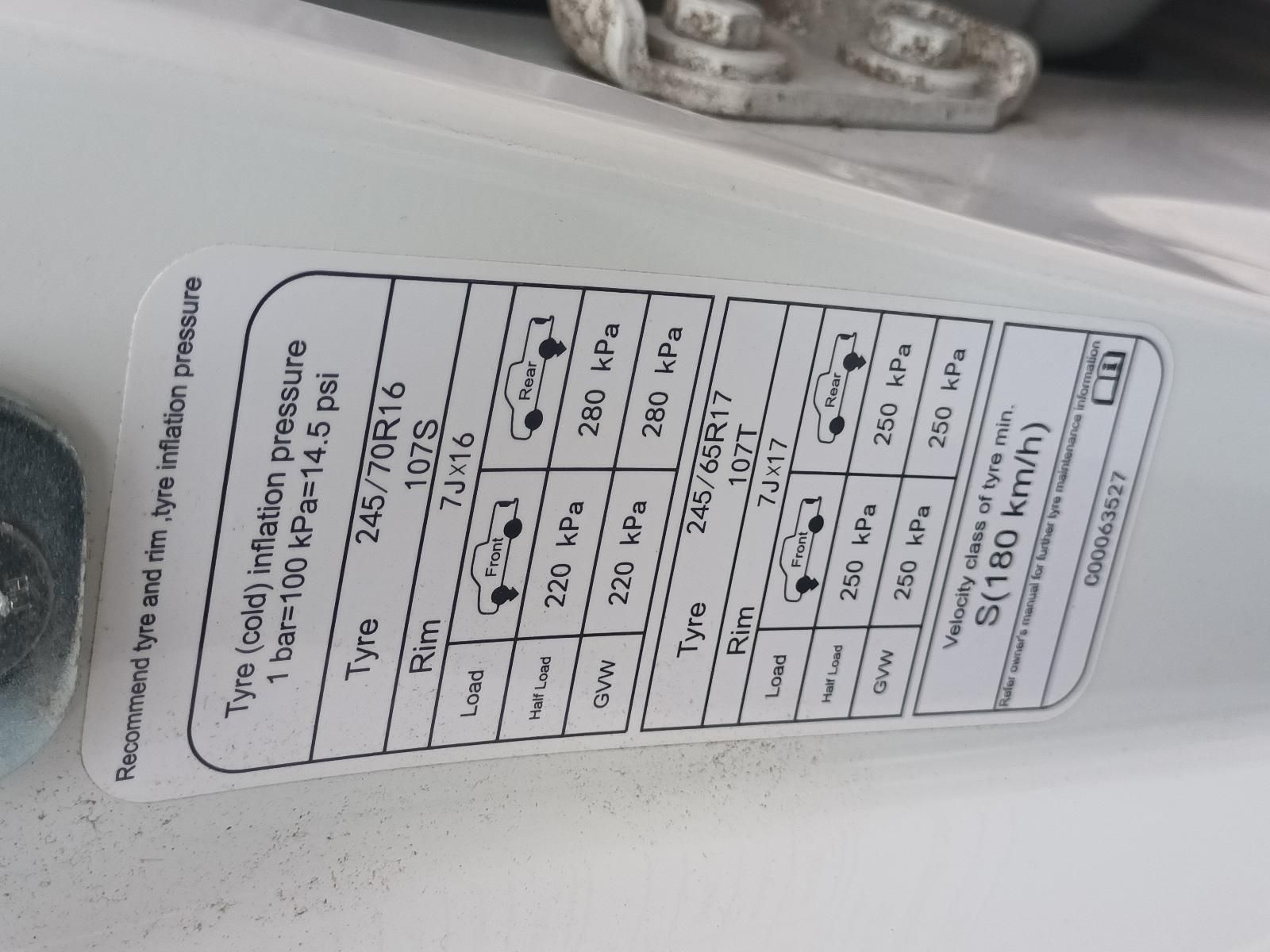 A Close Up of a Tire Pressure Sticker on a Car — South West 4WD Wreckers In Brisbane, QLD