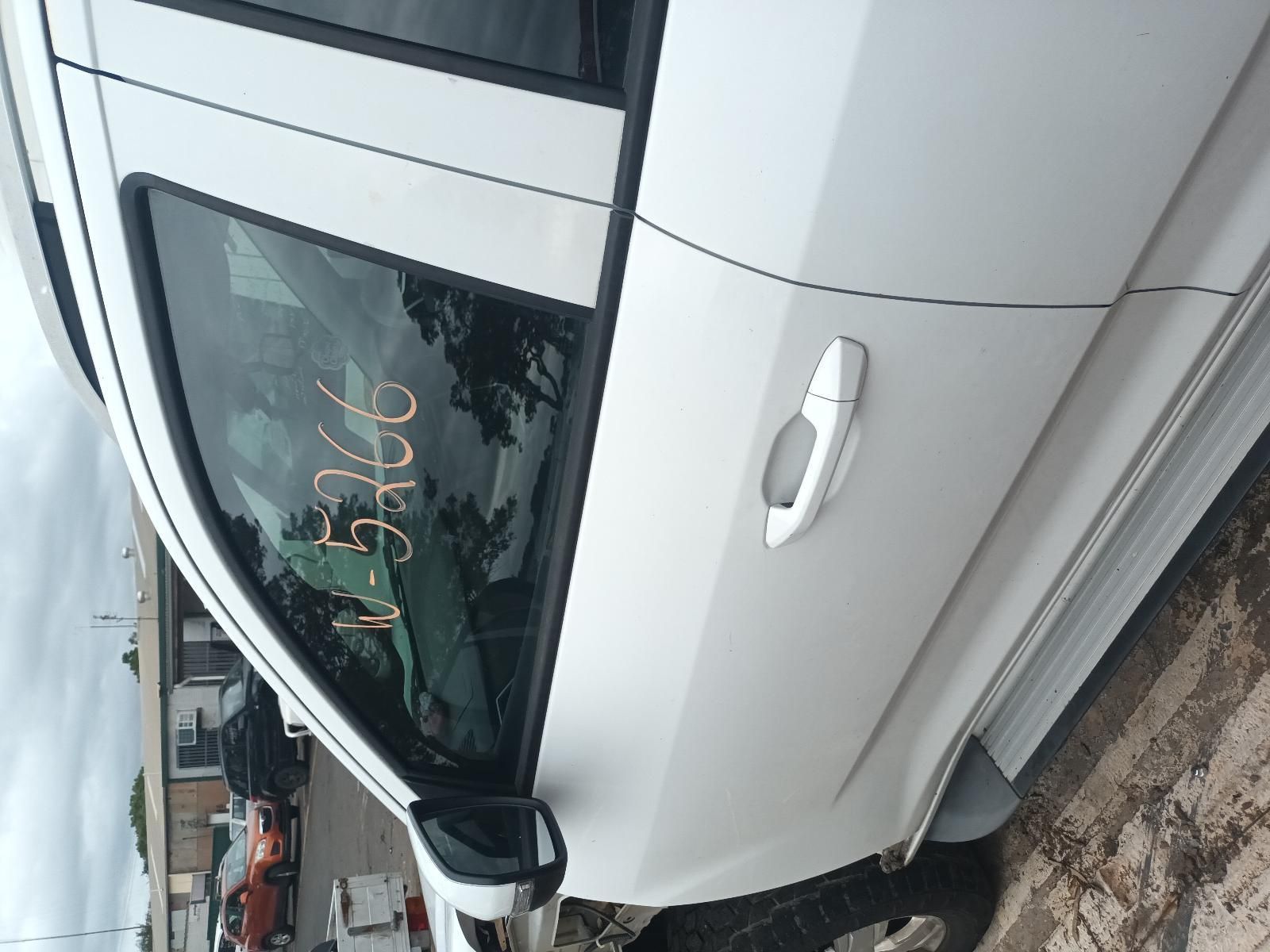 A White Car is Parked on the Side of the Road — South West 4WD Wreckers In Brisbane, QLD