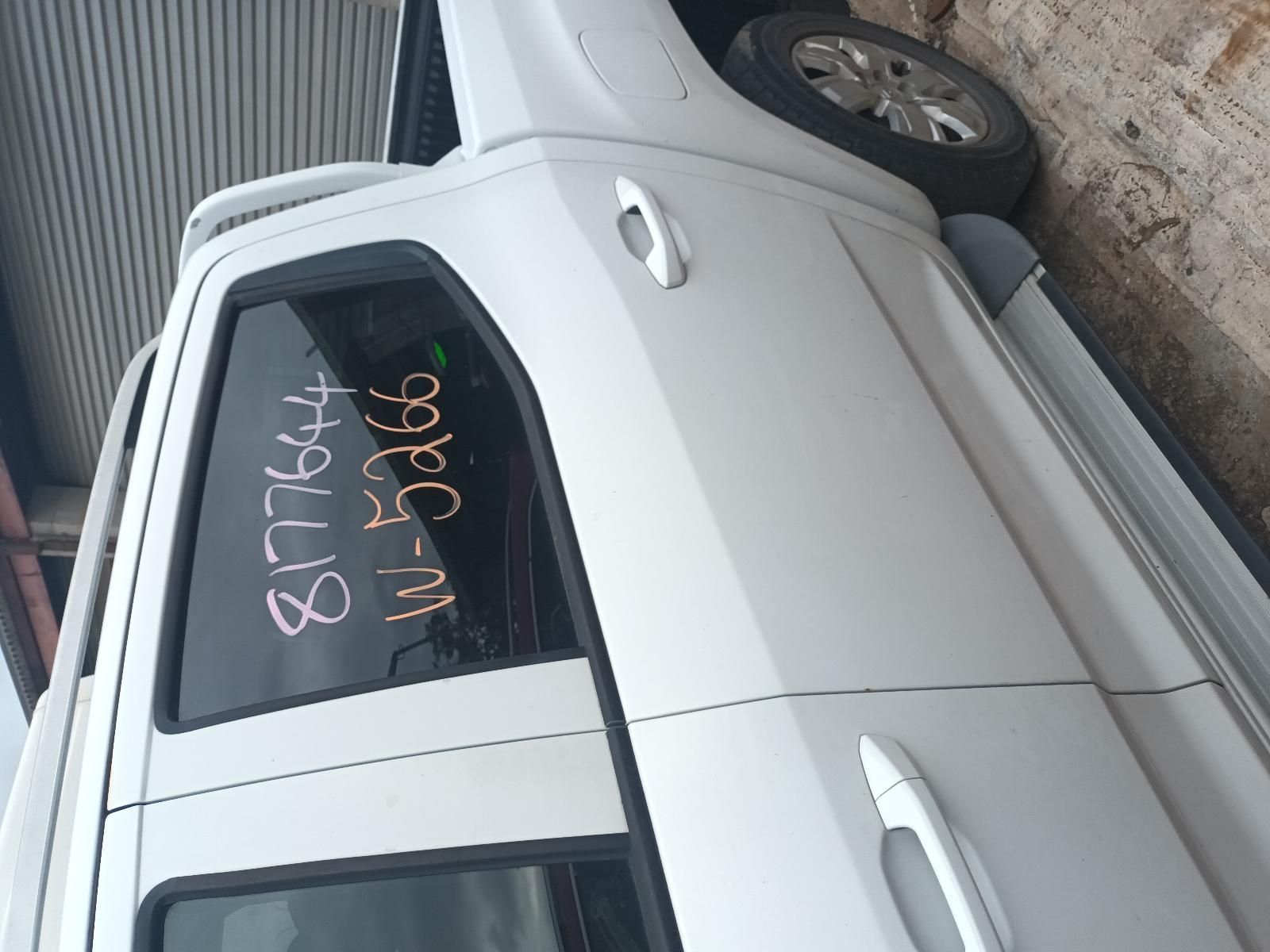 A White Truck with Numbers Written on the Window — South West 4WD Wreckers In Brisbane, QLD