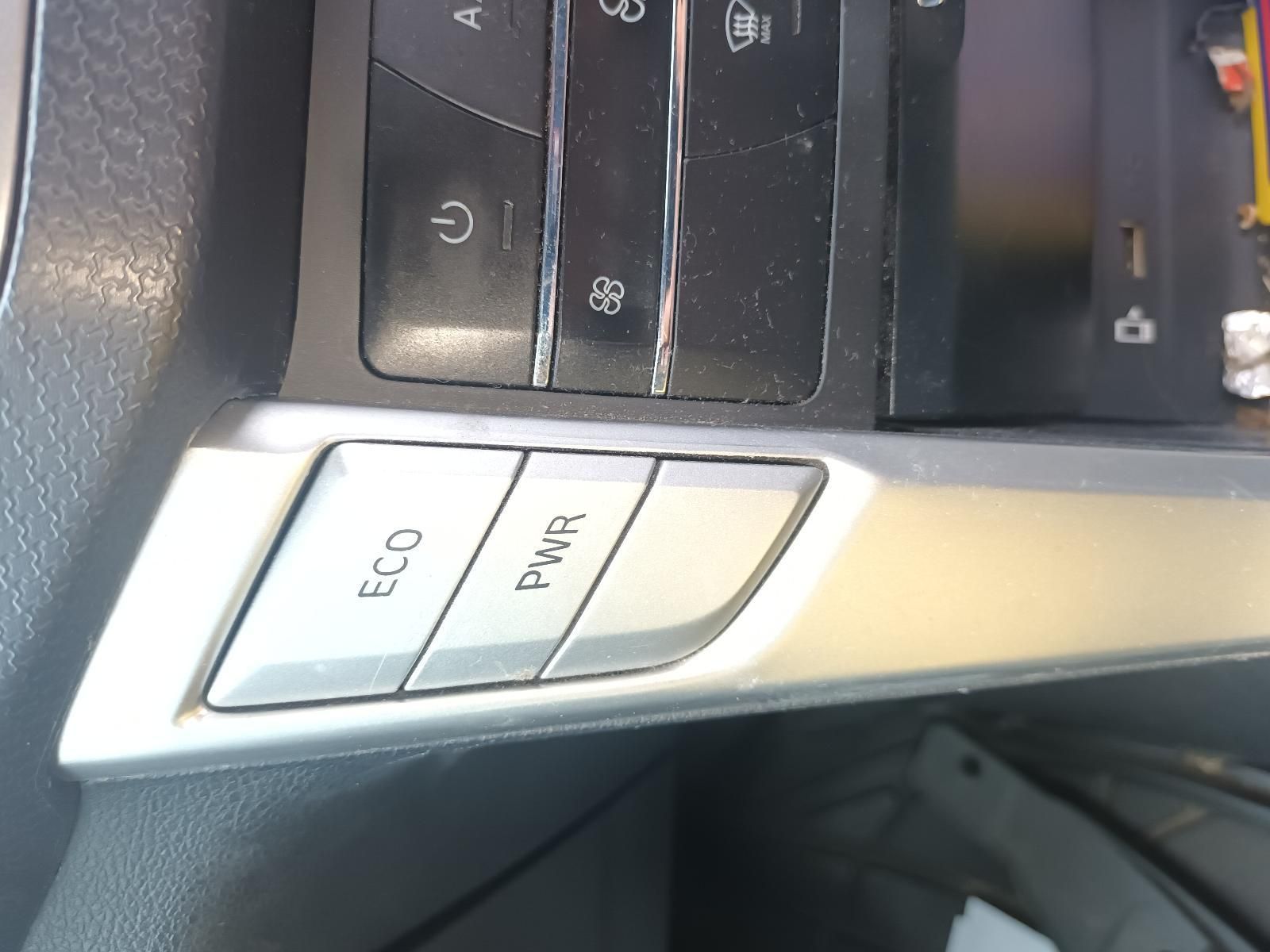 A Close Up of the Eco and Pwr Buttons on a Car Dashboard — South West 4WD Wreckers In Brisbane, QLD