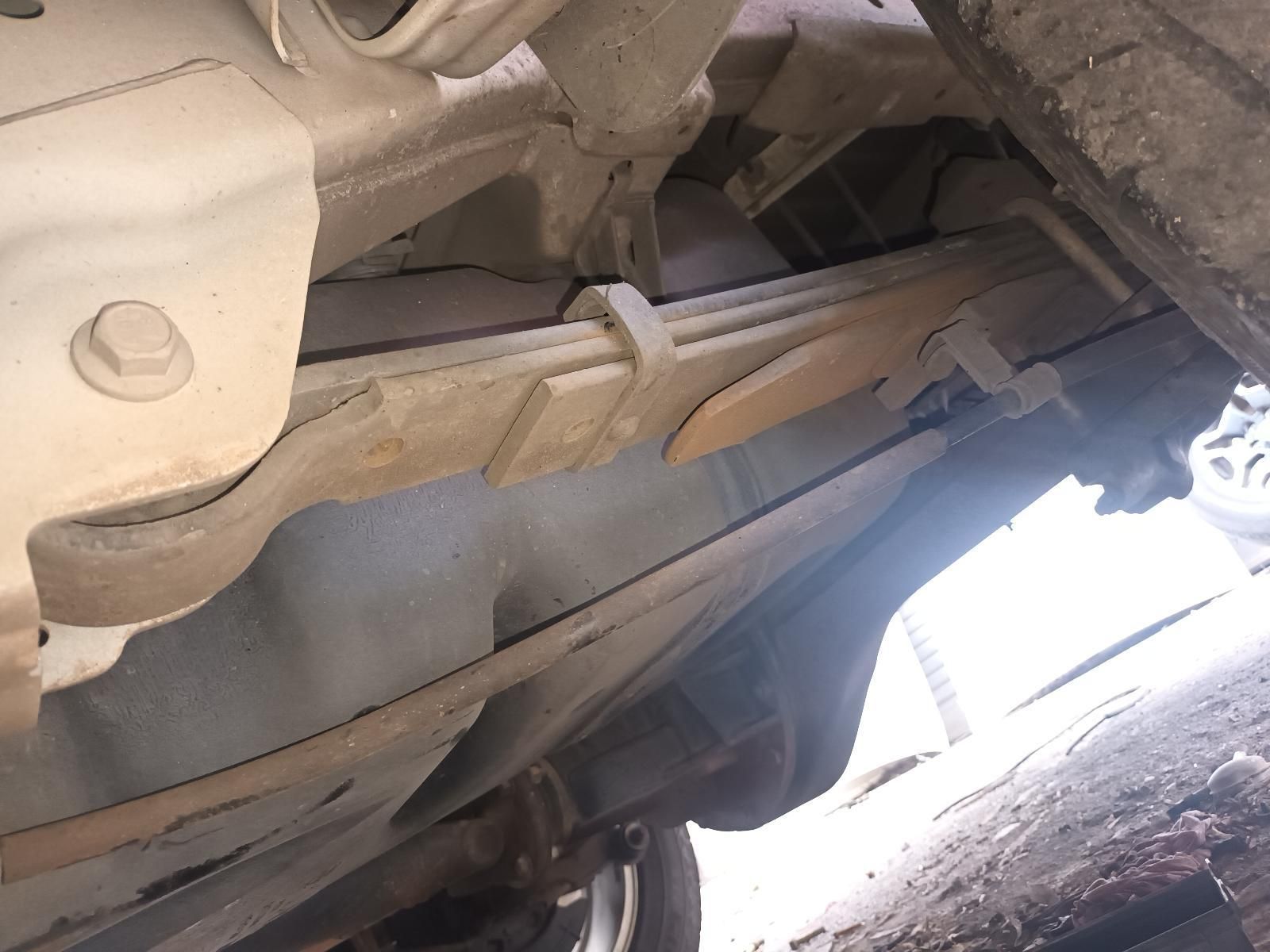 A Close Up of the Underside of a Car Showing a Leaf Spring — South West 4WD Wreckers In Brisbane, QLD