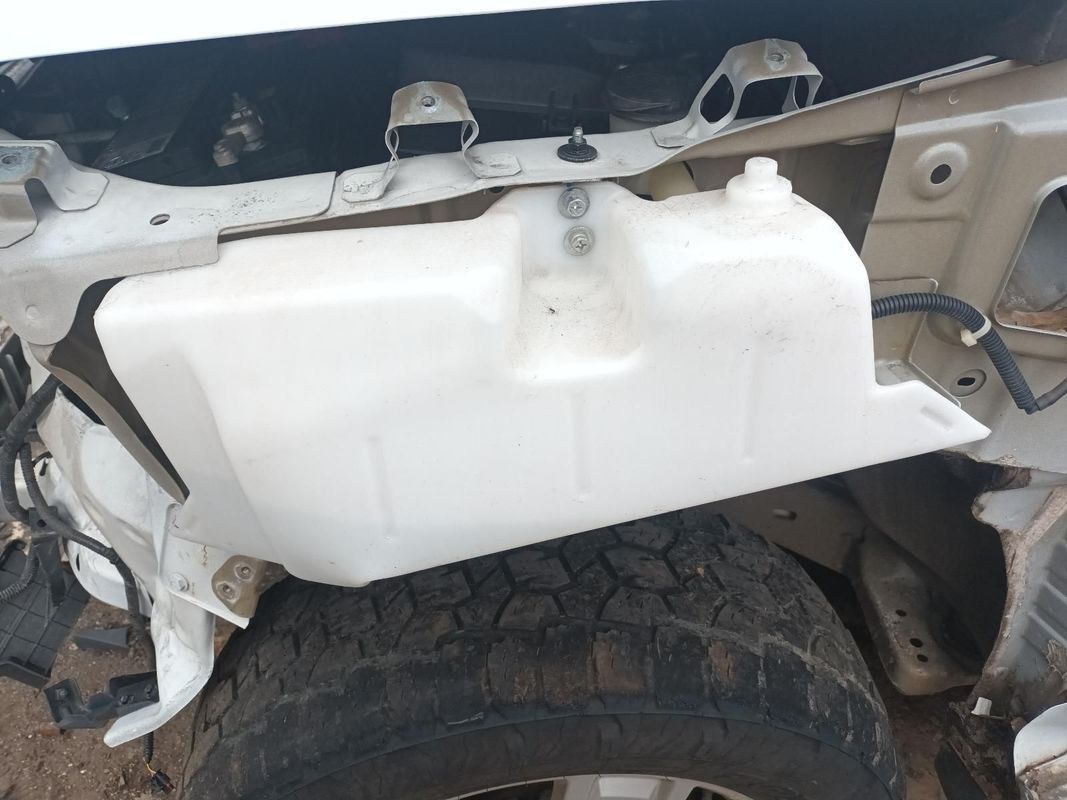 A White Container is Sitting on the Side of a Car — South West 4WD Wreckers In Brisbane, QLD