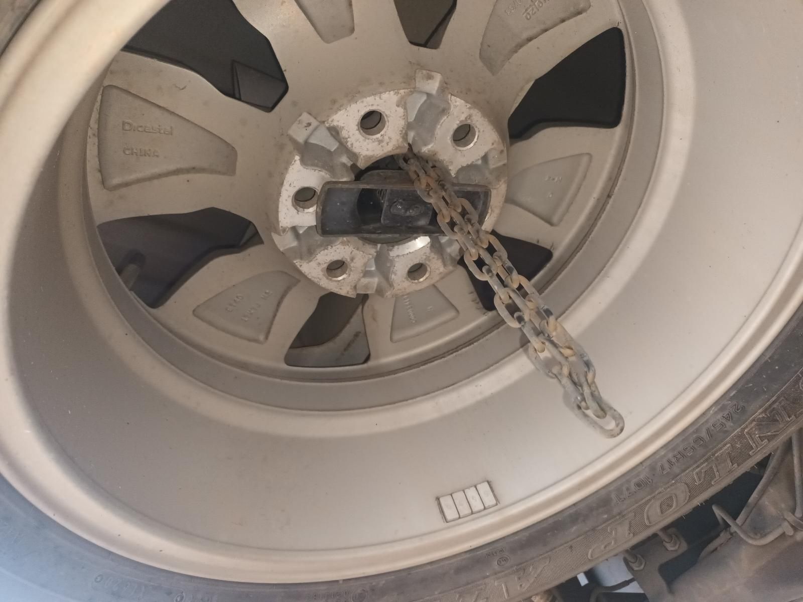 A Close Up of a Wheel with a Chain Attached to It — South West 4WD Wreckers In Brisbane, QLD