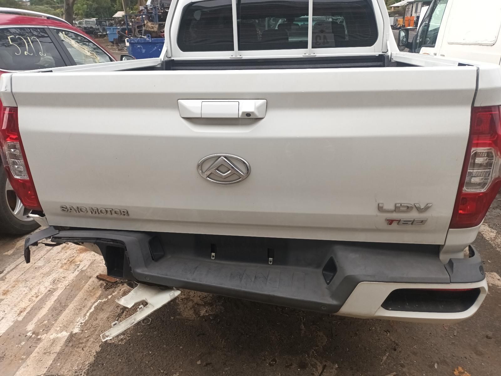 The Back End of a White Pickup Truck is Shown — South West 4WD Wreckers In Brisbane, QLD