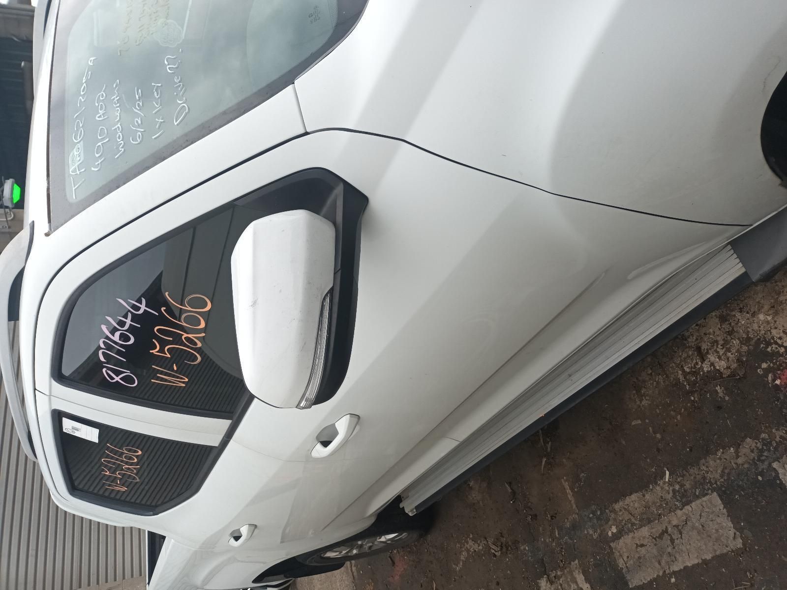 A White Car is Parked on the Side of the Road — South West 4WD Wreckers In Brisbane, QLD