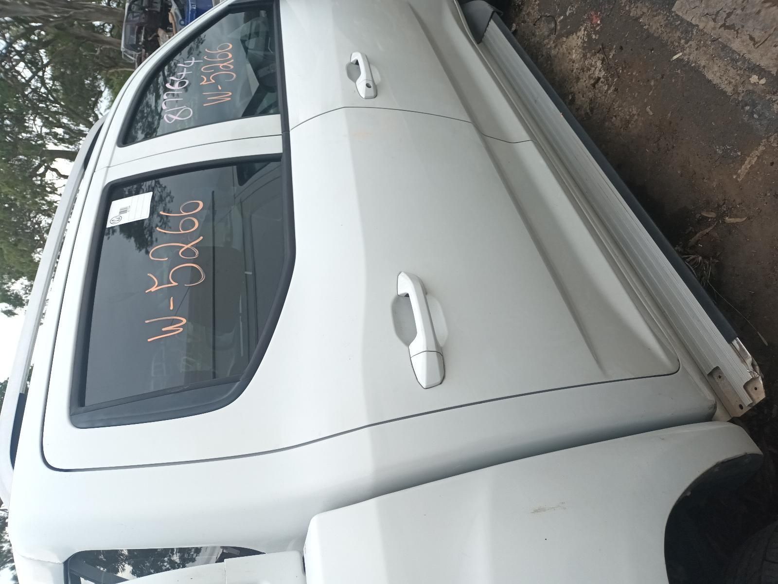 A White Truck is Parked on the Side of the Road — South West 4WD Wreckers In Brisbane, QLD