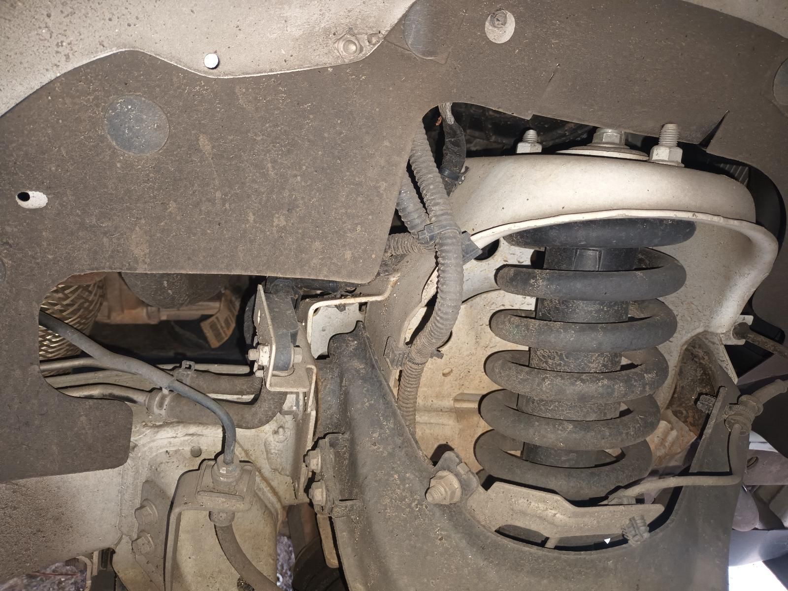 A Close Up of a Shock Absorber on a Car — South West 4WD Wreckers In Brisbane, QLD