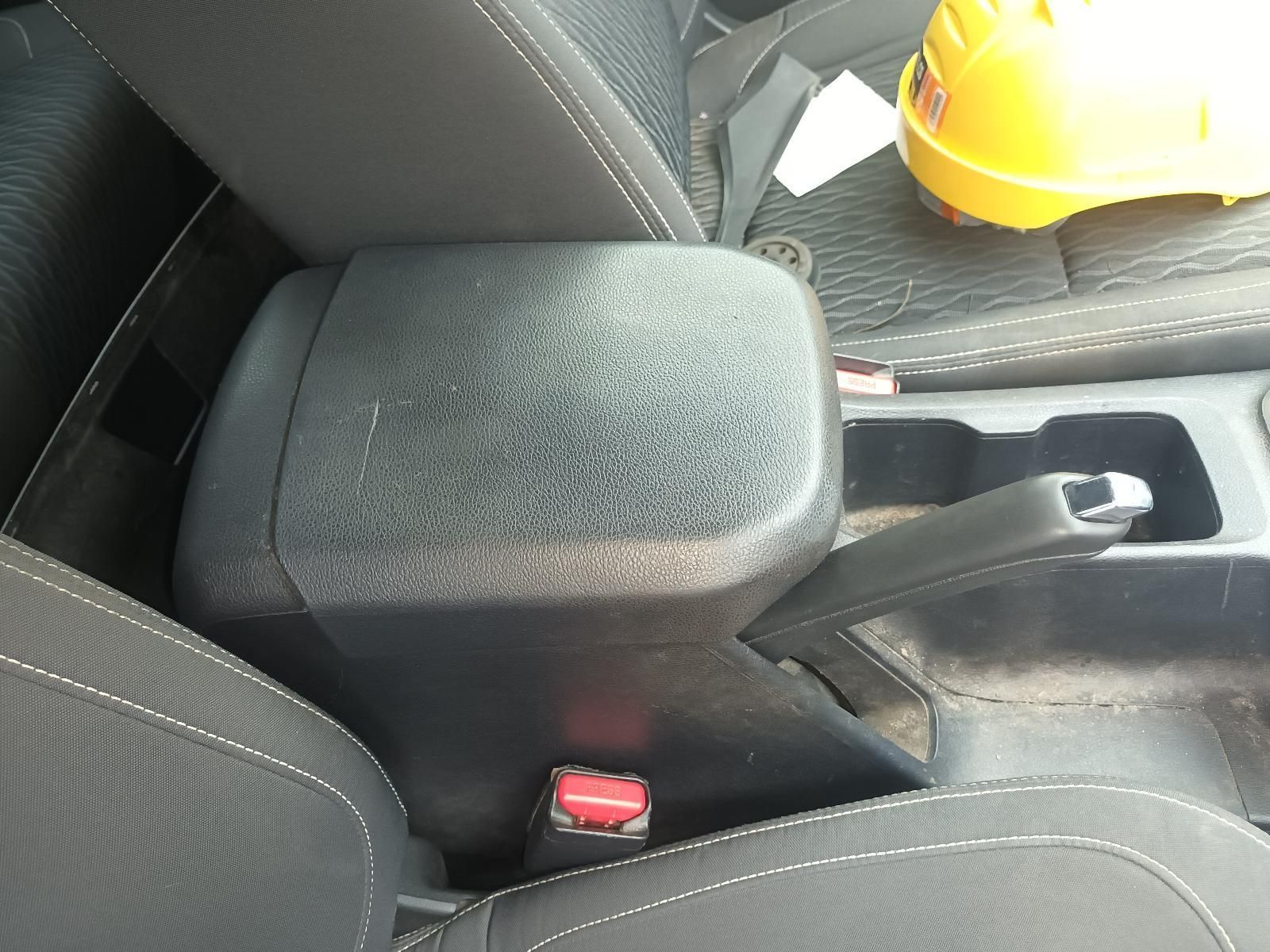 A Yellow Hard Hat Sits on the Seat of a Car — South West 4WD Wreckers In Brisbane, QLD