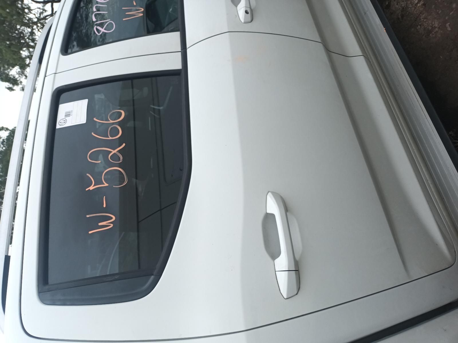 A White Car with a Letter and Numbers Written on It — South West 4WD Wreckers In Brisbane, QLD