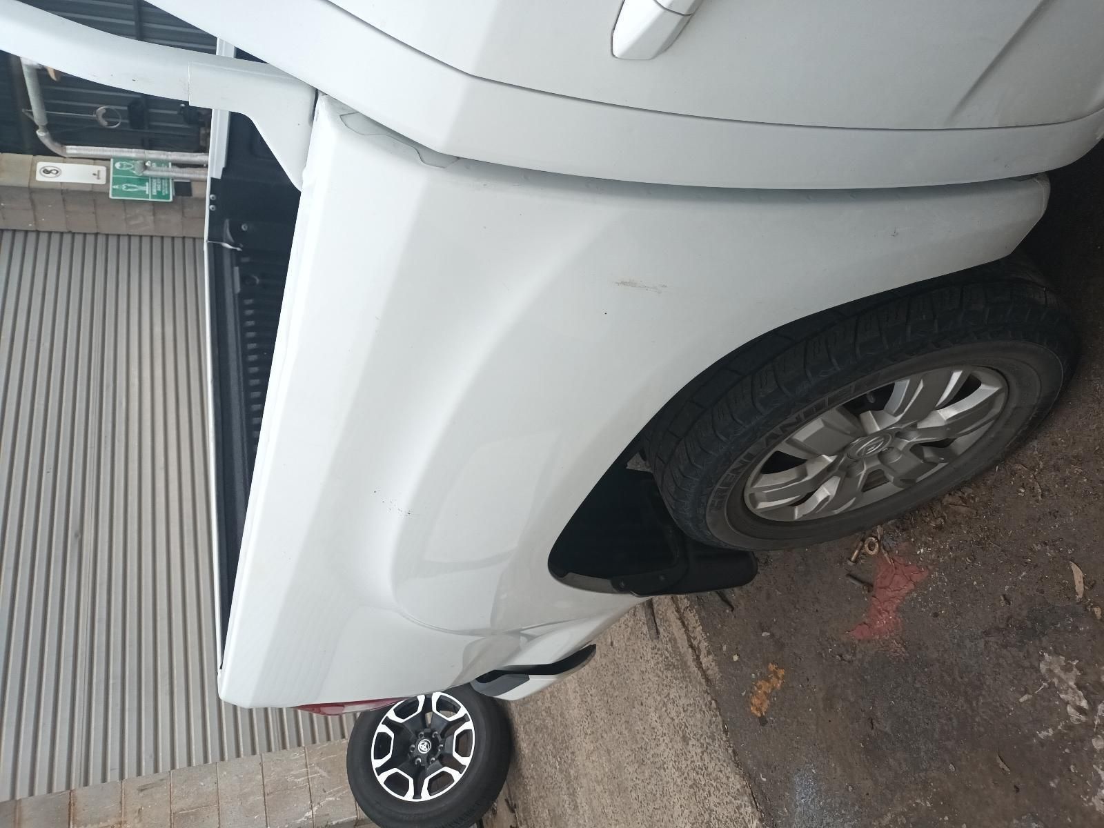 A White Truck is Parked on the Side of the Road — South West 4WD Wreckers In Brisbane, QLD