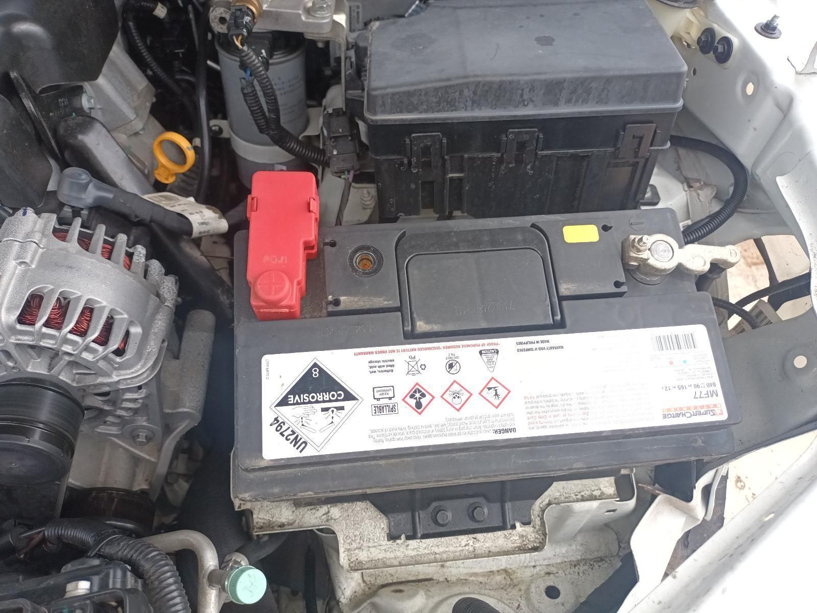 A Car Battery is Sitting Under the Hood of a Car — South West 4WD Wreckers In Brisbane, QLD