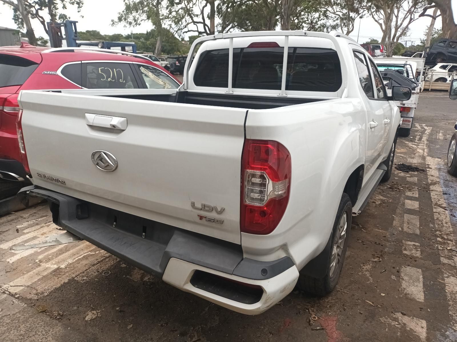 A White Pickup Truck is Parked in a Parking Lot — South West 4WD Wreckers In Brisbane, QLD