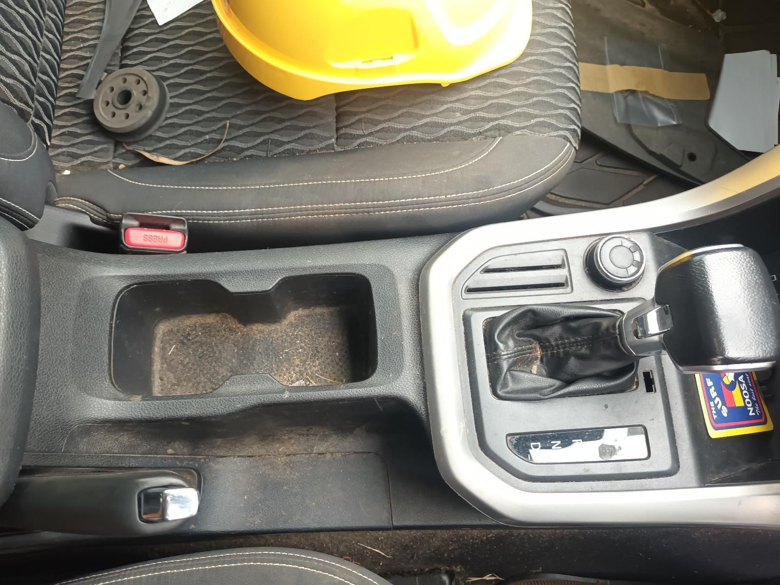 A Yellow Hard Hat is Sitting on the Seat of a Car — South West 4WD Wreckers In Brisbane, QLD