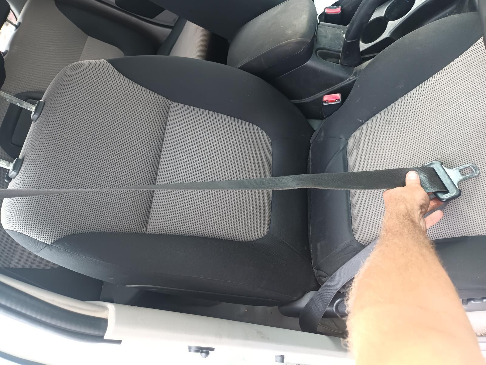 A Person is Holding a Seat Belt in a Car — South West 4WD Wreckers In Brisbane, QLD